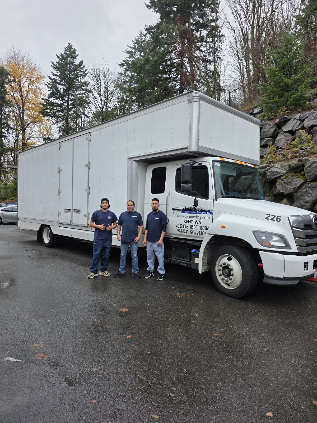Puget Sound Moving crew with branded truck in Seattle